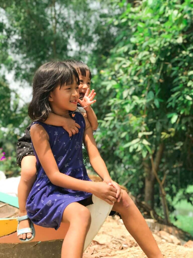 Children playing outdoors in summer - a healthy balance alongside preventing summer learning loss